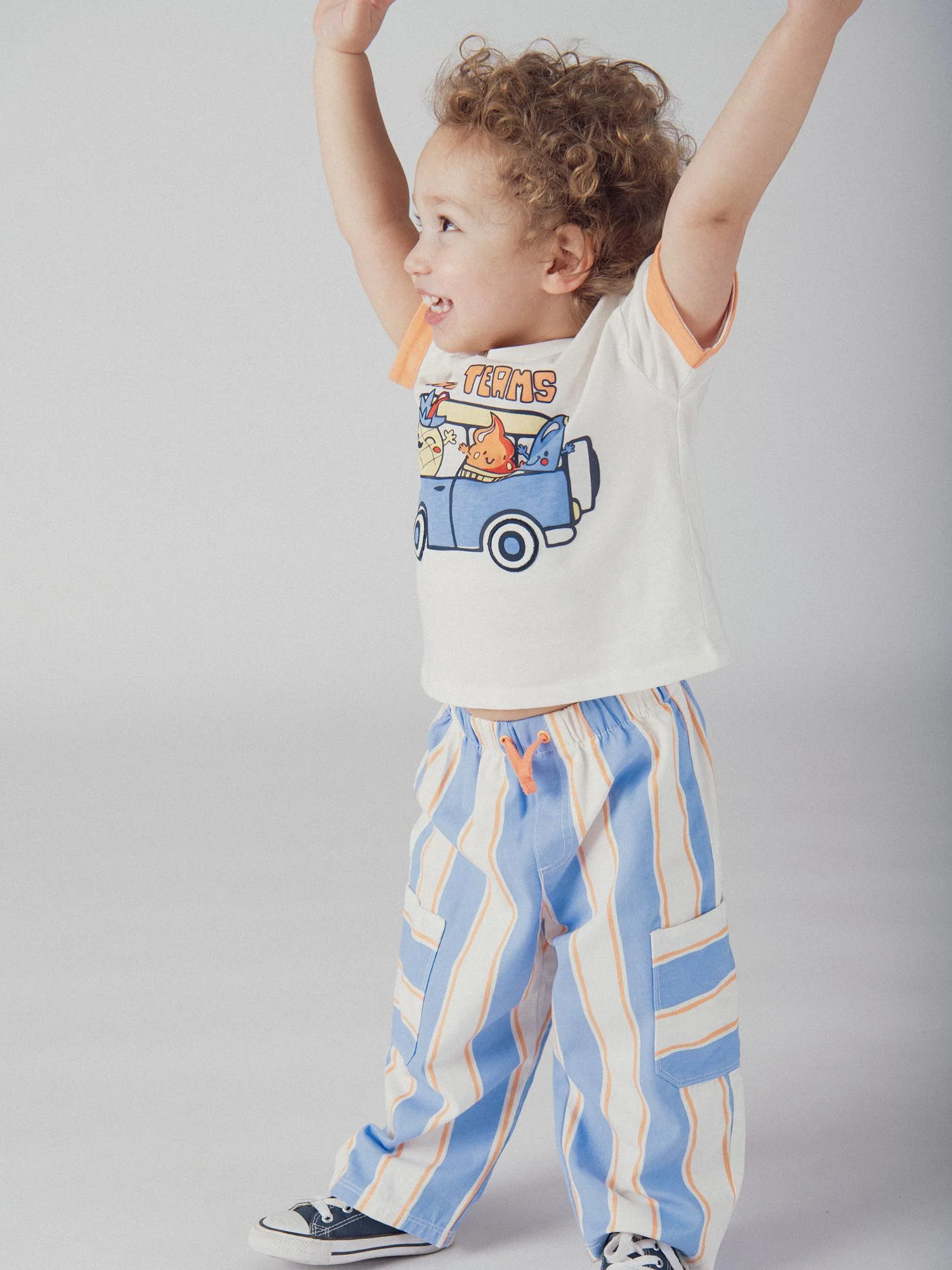 Pantaloni rigati blu e pesca per bimbo - Image 2