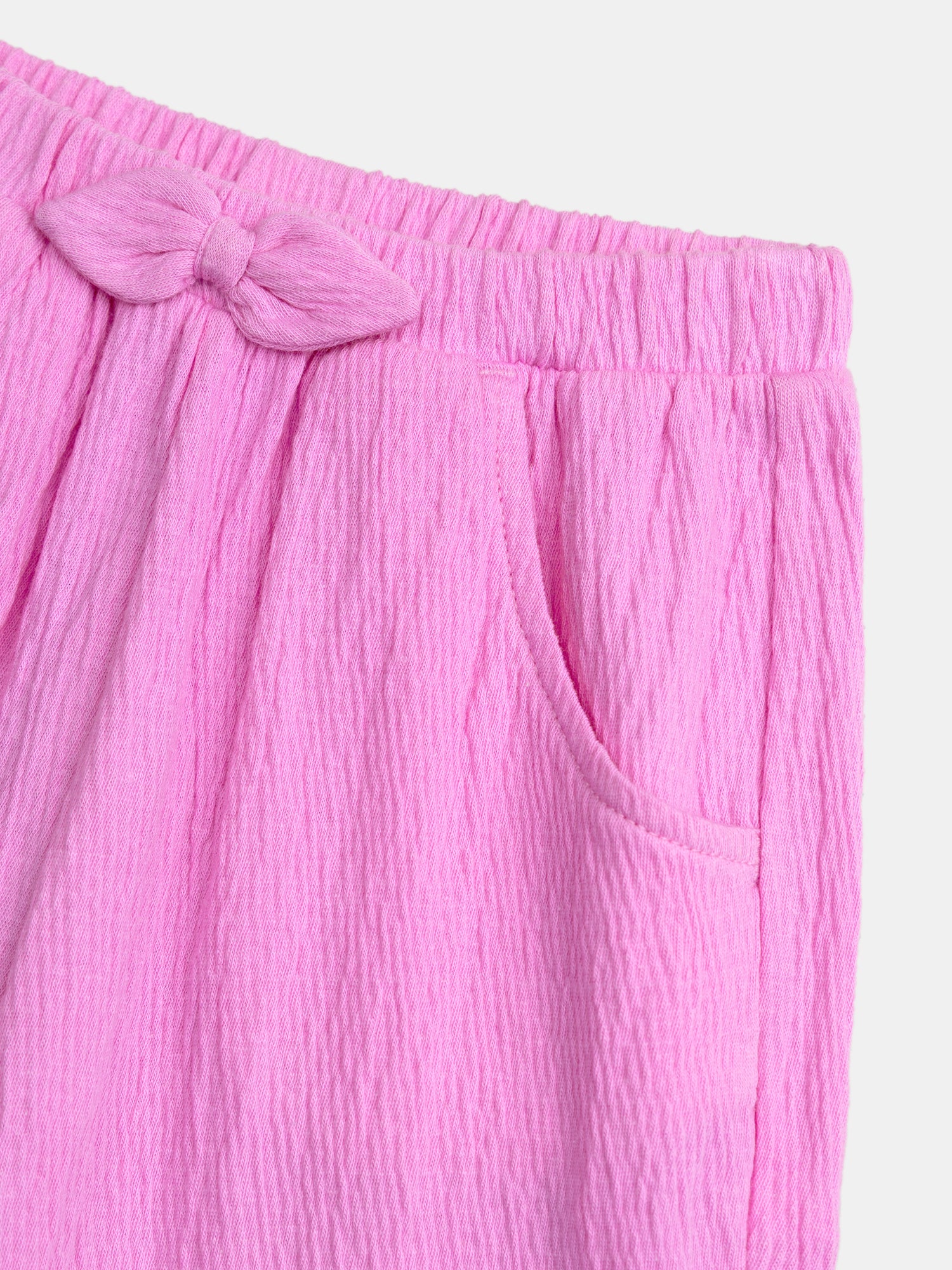 Pantaloni rosa caramella con fiocco per bambine - Image 4